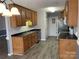Functional kitchen with ample counter space, wood cabinets, and modern appliances at 104 Johnsbury Dr, Stanley, NC 28164