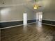 Living room with wood-look floors, neutral paint, and lots of square footage at 104 Johnsbury Dr, Stanley, NC 28164