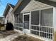 An exterior shot of a screened porch with wooden deck, providing a relaxing outdoor space at 104 Johnsbury Dr, Stanley, NC 28164