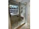 Elegant step-in shower showcasing modern fixtures, mosaic tile accents, and a glass block window at 104 Johnsbury Dr, Stanley, NC 28164
