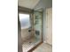 Modern glass-enclosed shower with tiled walls, built-in shelves, and a convenient fold-down seat at 104 Johnsbury Dr, Stanley, NC 28164