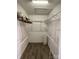 Well-organized walk-in closet featuring wire shelving and durable hard surface floors at 104 Johnsbury Dr, Stanley, NC 28164