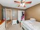 Cozy bedroom with a ceiling fan, closet, neutral walls, and carpet flooring at 10736 Spruce Mountain Rd, Charlotte, NC 28214