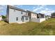 Fenced backyard with green grass and a concrete patio; perfect for entertaining at 1120 Freeman View Dr, Albemarle, NC 28001