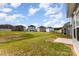 View of the lush green backyard and surrounding homes in a well maintained community at 1120 Freeman View Dr, Albemarle, NC 28001