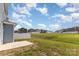 Spacious backyard features green grass, a concrete patio, and a white fence at 1120 Freeman View Dr, Albemarle, NC 28001