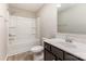 This bathroom is equipped with a bathtub-shower combo, toilet and sink with wooden vanity at 1120 Freeman View Dr, Albemarle, NC 28001