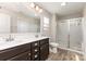 A Primary bathroom with double sinks, a toilet, and a glass-doored shower at 1120 Freeman View Dr, Albemarle, NC 28001