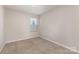 This carpeted bedroom features a window and neutral-colored walls at 1120 Freeman View Dr, Albemarle, NC 28001