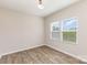 This bedroom features beautiful wood flooring and great natural light from the double windows at 1120 Freeman View Dr, Albemarle, NC 28001