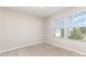 This bedroom features carpeted floors and lots of natural light from the double windows at 1120 Freeman View Dr, Albemarle, NC 28001