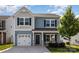 Charming two-story home with blue siding, black shutters, and well-manicured front yard at 1120 Freeman View Dr, Albemarle, NC 28001