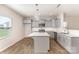 Modern kitchen with gray cabinets, white countertops, stainless steel appliances, and central island at 1120 Freeman View Dr, Albemarle, NC 28001