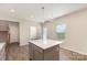 Modern kitchen with gray cabinets, white countertops, stainless steel appliances, and central island at 1120 Freeman View Dr, Albemarle, NC 28001