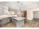 Modern kitchen with gray cabinets, white countertops, stainless steel appliances, and central island at 1120 Freeman View Dr, Albemarle, NC 28001