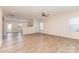 Spacious living room featuring wood-look floors and open floor plan with access to the kitchen at 1120 Freeman View Dr, Albemarle, NC 28001