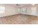 Bright living room features wood-look floors, ceiling fan, and plenty of natural light at 1120 Freeman View Dr, Albemarle, NC 28001