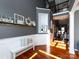 Inviting entryway featuring a decorative shelf, bench, and hardwood floors at 12729 Mcginnis Ln, Huntersville, NC 28078