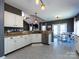 Bright kitchen with stainless steel appliances, tile floors, and easy access to dining area at 12729 Mcginnis Ln, Huntersville, NC 28078