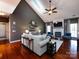 Bright living room with vaulted ceilings, hardwood floors, fireplace, and comfortable seating at 12729 Mcginnis Ln, Huntersville, NC 28078
