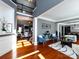 Open concept living room with hardwood floors, natural light, and views to the dining area at 12729 Mcginnis Ln, Huntersville, NC 28078