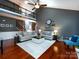 Spacious living room with high ceilings, hardwood floors, and lots of natural light at 12729 Mcginnis Ln, Huntersville, NC 28078