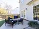 Outdoor patio with seating, grill, and manicured landscaping for relaxed outdoor living at 12729 Mcginnis Ln, Huntersville, NC 28078