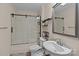 Bathroom with a glass-enclosed shower, floating shelves, and modern fixtures creating a relaxing space at 133 2Nd Ave, China Grove, NC 28023