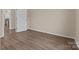 Simple room with wood-look floors and neutral walls, offering a blank canvas for personalization at 133 2Nd Ave, China Grove, NC 28023