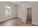 Comfortable bedroom featuring a window with natural light and an organized closet space at 133 2Nd Ave, China Grove, NC 28023