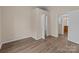 Bright bedroom with wood-look floors and neutral walls offers ample space and closet access at 133 2Nd Ave, China Grove, NC 28023