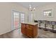 Eat-in kitchen features a kitchen island, granite counters, and a bar with comfortable seating at 133 2Nd Ave, China Grove, NC 28023
