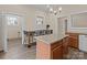 Eat-in kitchen features granite countertops, island, and modern lighting at 133 2Nd Ave, China Grove, NC 28023