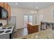 Kitchen featuring stainless appliances, granite countertops, and a central island perfect for dining at 133 2Nd Ave, China Grove, NC 28023