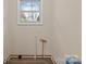 Laundry room with a window offering natural light and a clean, functional space for chores at 133 2Nd Ave, China Grove, NC 28023
