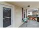 Inviting front porch with comfortable seating, offering a relaxing outdoor space with stylish black and wood railing at 133 2Nd Ave, China Grove, NC 28023