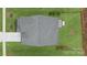 Aerial view of the home's roof, driveway, and surrounding lush green lawn and landscaping at 141 Rhuidean Ct, Troutman, NC 28166