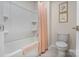 Bright bathroom featuring a shower-tub combination, a toilet, and framed art on the wall at 141 Rhuidean Ct, Troutman, NC 28166