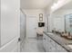 Modern bathroom featuring a granite countertop, a glass enclosed shower, and marble floors at 141 Rhuidean Ct, Troutman, NC 28166