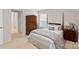 Bright bedroom with decorative furnishings, a plush bedspread, and a sunny window at 141 Rhuidean Ct, Troutman, NC 28166