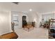 Cozy bonus room with natural light, seating area, shelving, and neutral-colored carpet at 141 Rhuidean Ct, Troutman, NC 28166