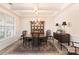 Traditional dining room featuring a wooden table, cabinet, and a coffered ceiling at 141 Rhuidean Ct, Troutman, NC 28166