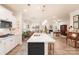 Spacious kitchen with an island, white countertops, and an open layout to the living area at 141 Rhuidean Ct, Troutman, NC 28166
