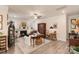 Inviting living room with a fireplace, wood floors, and ample seating arrangements at 141 Rhuidean Ct, Troutman, NC 28166