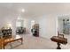 Spacious living room with a mix of furniture and decor and neutral-colored carpet at 141 Rhuidean Ct, Troutman, NC 28166