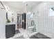 Elegant bathroom showcasing a walk-in shower, modern fixtures, and decorative tile flooring at 1711 Brook Rd, Charlotte, NC 28205