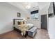 Cozy bedroom featuring hardwood floors, natural light, and stylish decor with a comfortable bed at 1711 Brook Rd, Charlotte, NC 28205