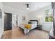 Bright bedroom with hardwood floors, a large window, and comfortable sleeping quarters at 1711 Brook Rd, Charlotte, NC 28205