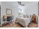 Light bedroom featuring a desk, a bed, a window, and white walls at 1711 Brook Rd, Charlotte, NC 28205