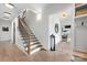 Bright foyer featuring a staircase, hardwood floors and views of the living room at 1711 Brook Rd, Charlotte, NC 28205